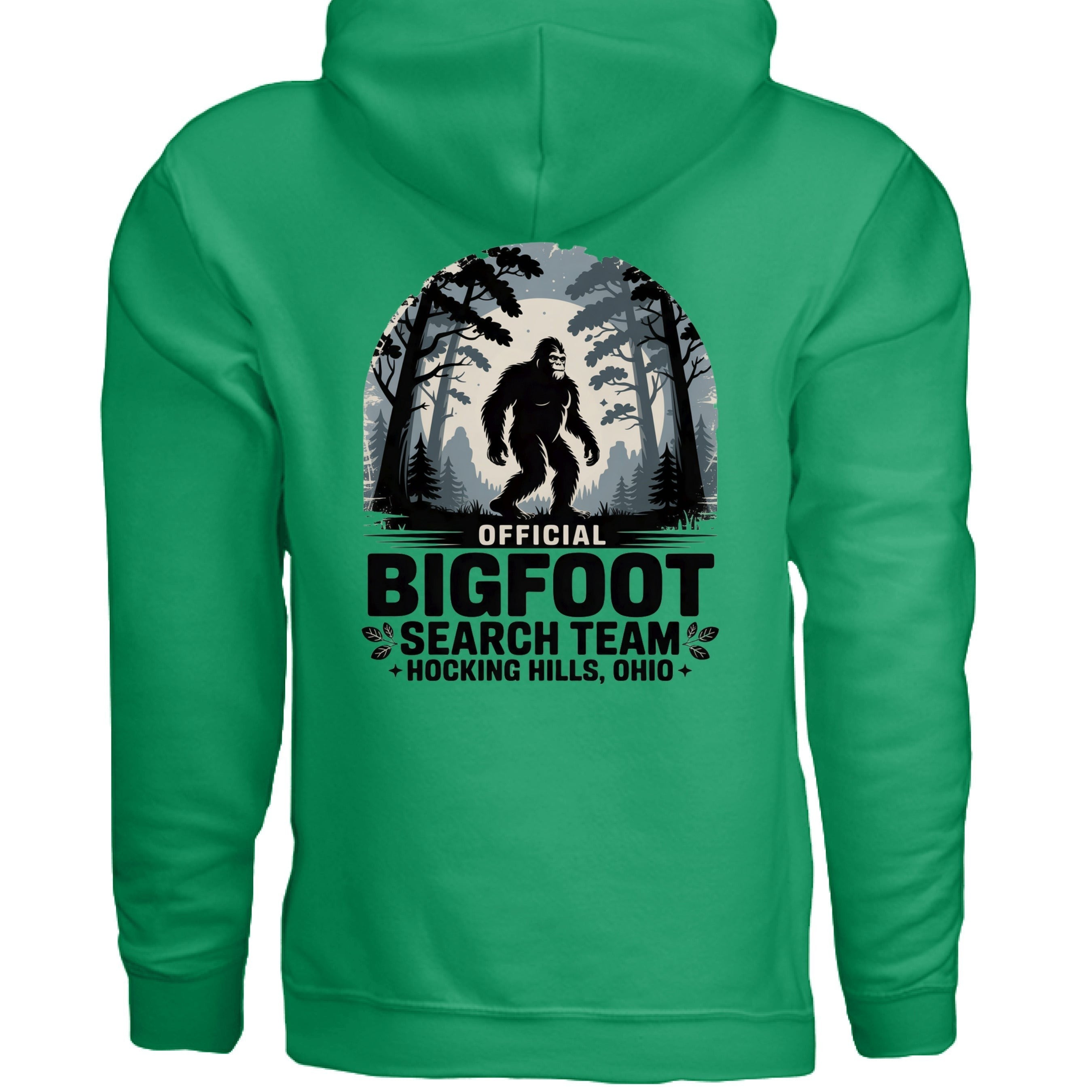 The Hocking Hills Store Official Bigfoot Search Team hoodie in green, featuring a Bigfoot graphic in a forest setting with text.