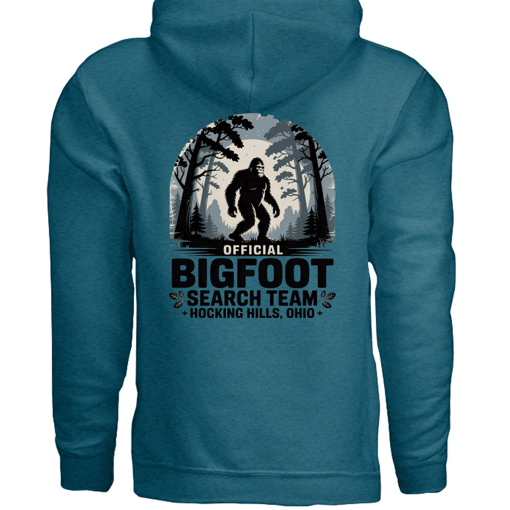 The Hocking Hills Store Official Bigfoot Search Team hoodie in teal, featuring a graphic of Bigfoot in a forest setting with the text "Official Bigfoot Search Team Hocking Hills, Ohio".