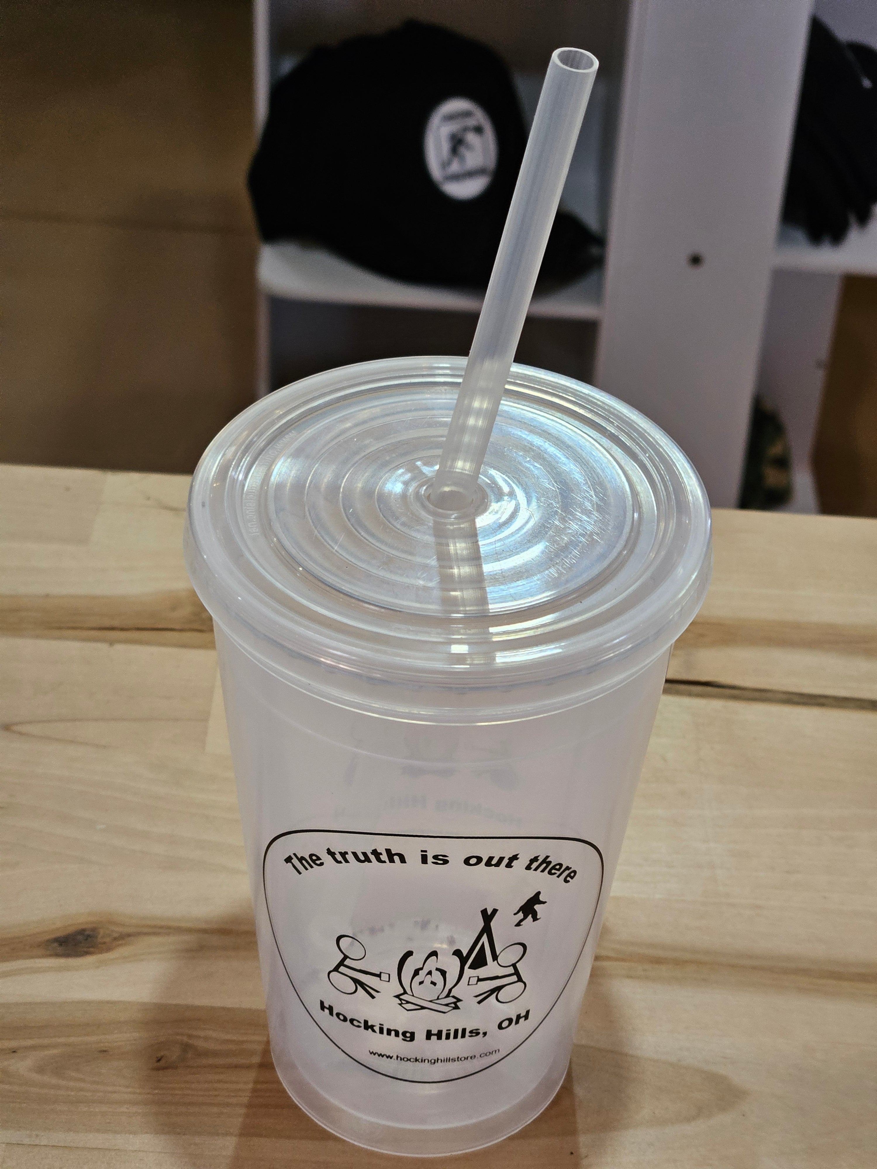 The Hocking Hills Store Bigfoot sipper cup with lid and straw, featuring "The truth is out there" slogan.
