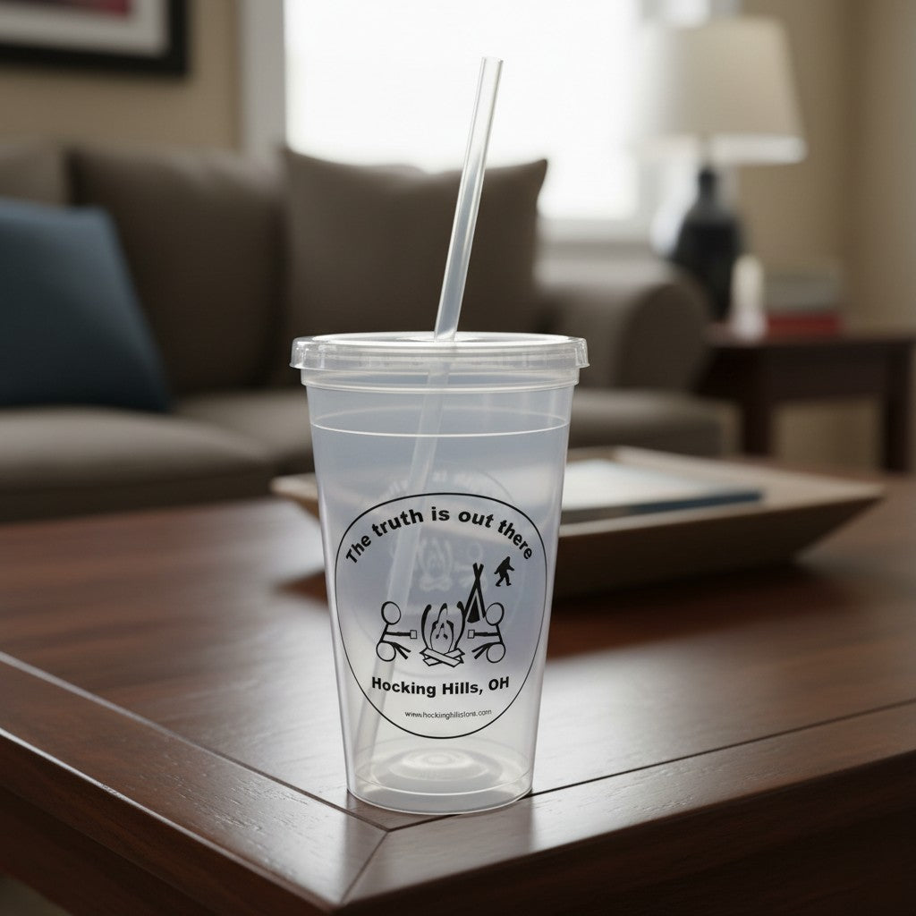 The Hocking Hills Store clear plastic sipper cup with lid and straw, featuring a Bigfoot and campfire graphic.