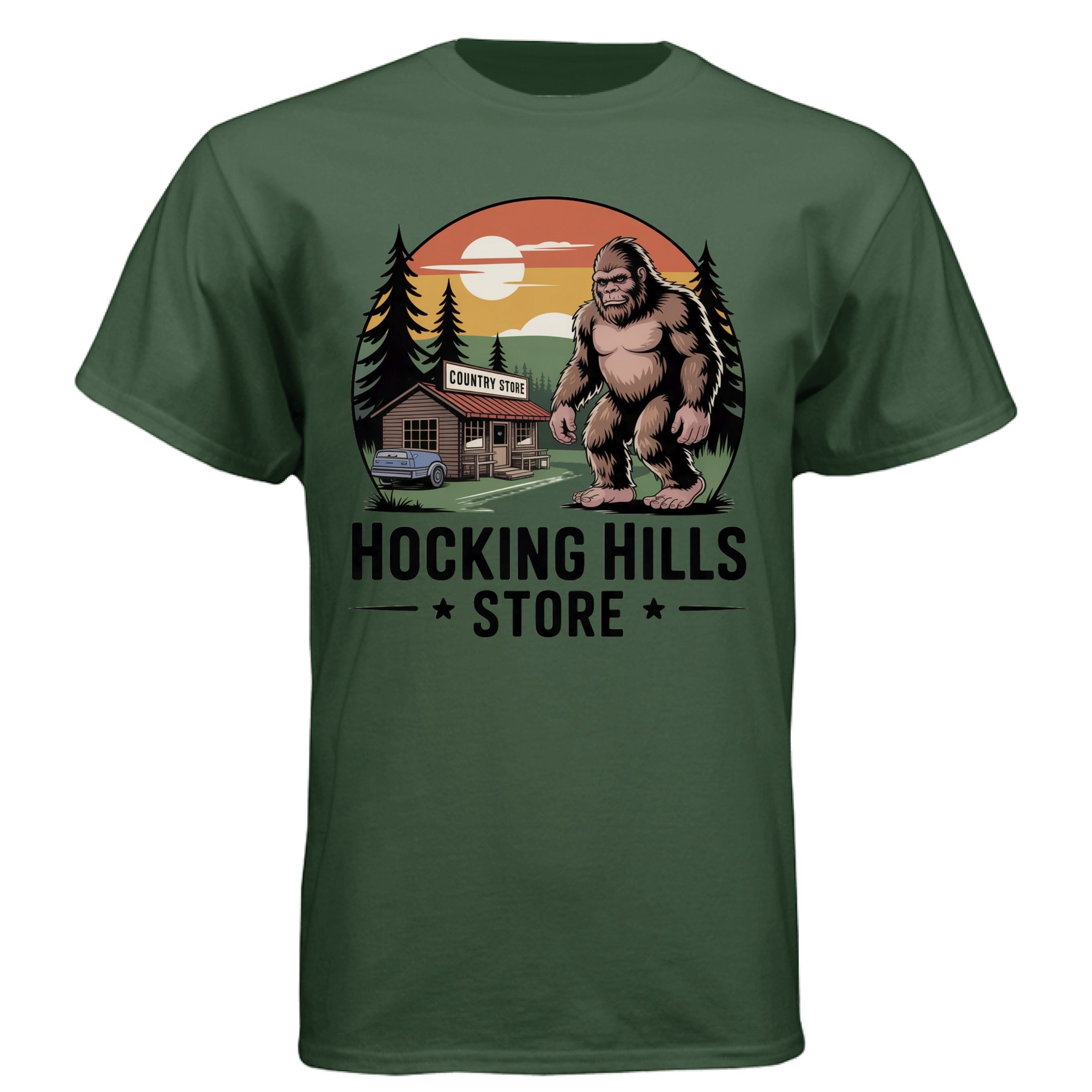 The Hocking Hills Store Bigfoot T-Shirt in forest green, featuring a Bigfoot graphic with a country store and sunset.