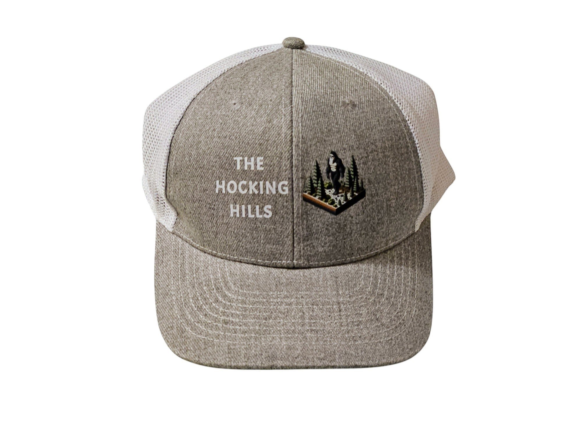 The Hocking Hills Store grey trucker hat with white mesh back, embroidered with "The Hocking Hills" and a Bigfoot graphic.