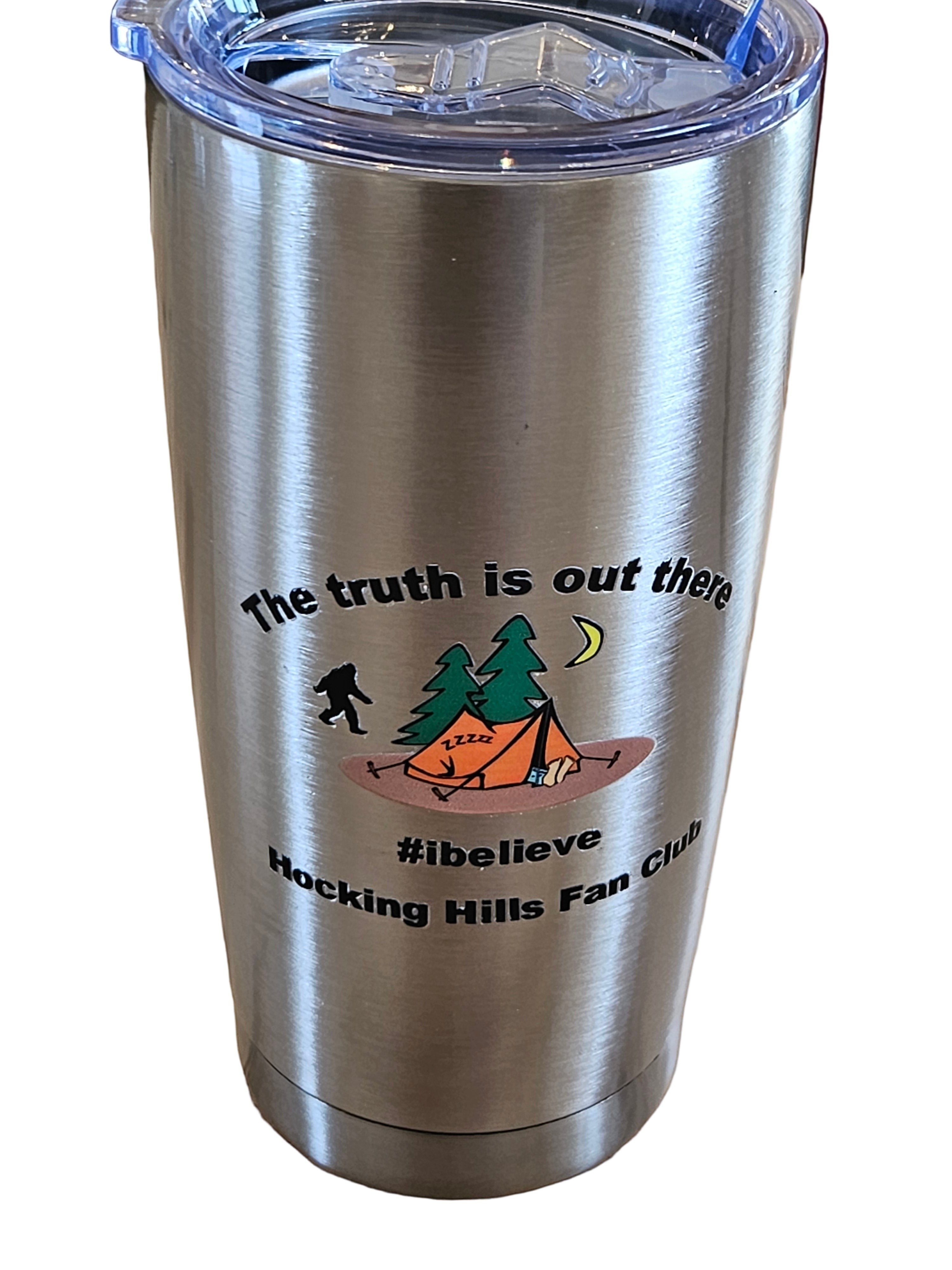 The Hocking Hills Store 20 oz stainless steel tumbler with Bigfoot, tent, and trees graphic. "The truth is out there #ibelieve Hocking Hills Fan Club".