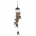 The Hocking Hills Store Bigfoot wind chimes are made of metal with copper-colored tubes and Bigfoot silhouettes.