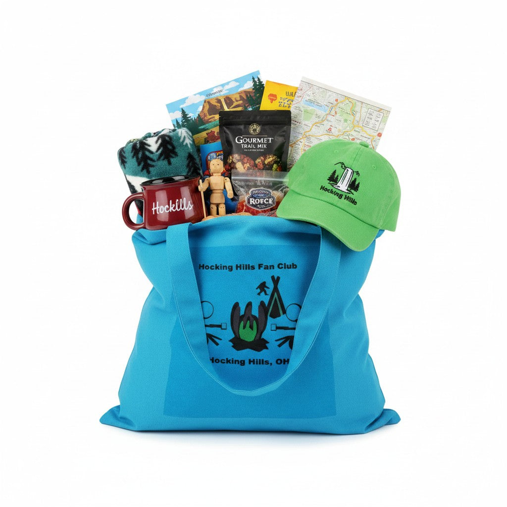 The Hocking Hills Store blue canvas tote bag with a graphic of a campfire and stick figures.