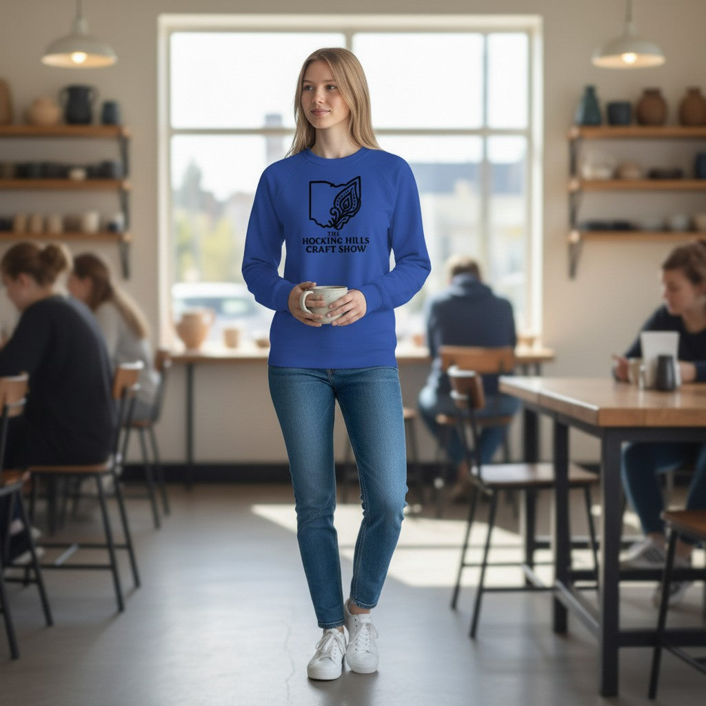 The Hocking Hills Store blue crew neck sweatshirt with Ohio outline and decorative floral design, featuring "The Hocking Hills Craft Show" text.