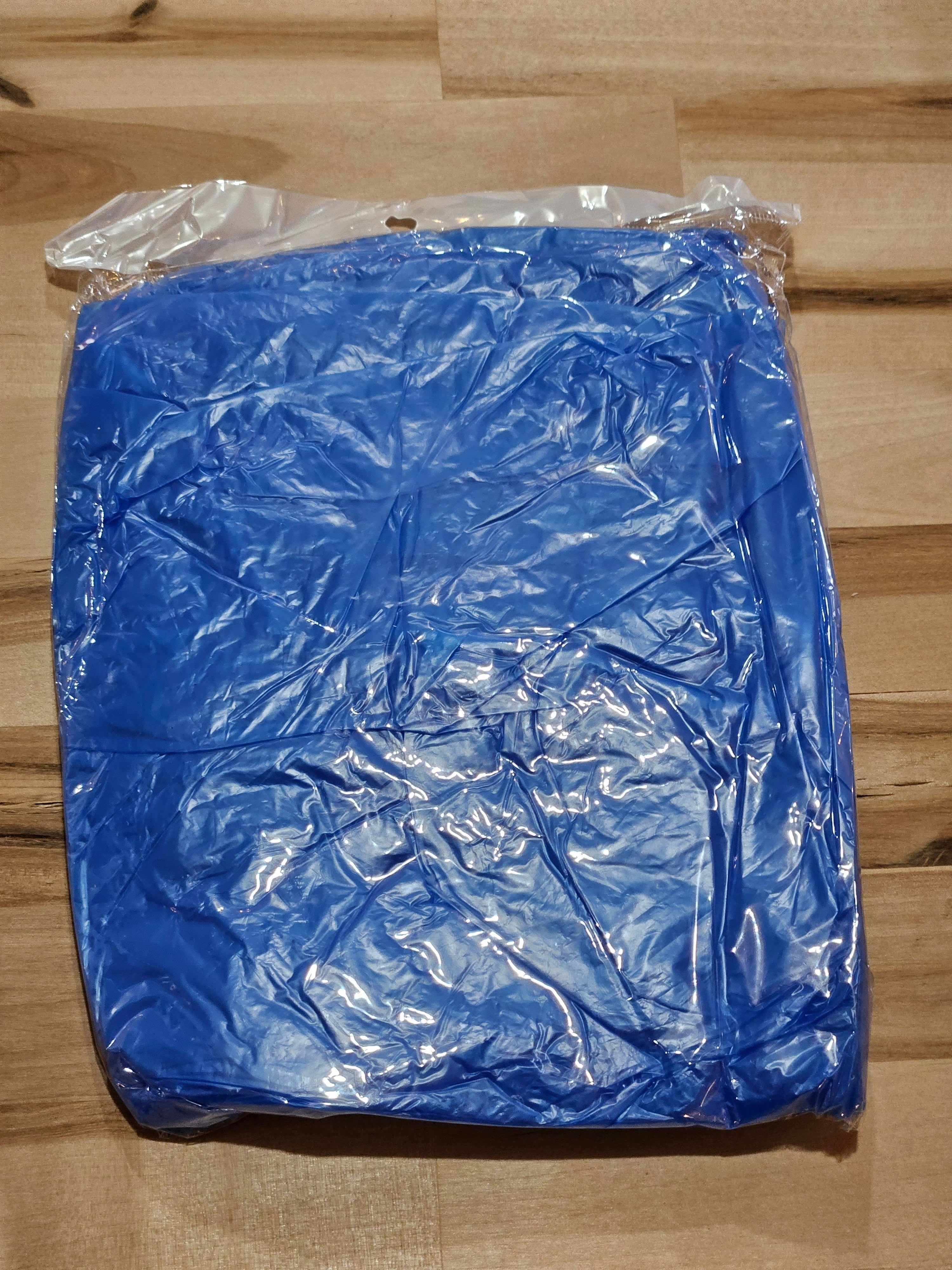 The Hocking Hills Store blue disposable emergency rain poncho in clear plastic packaging for travel and outdoor events.