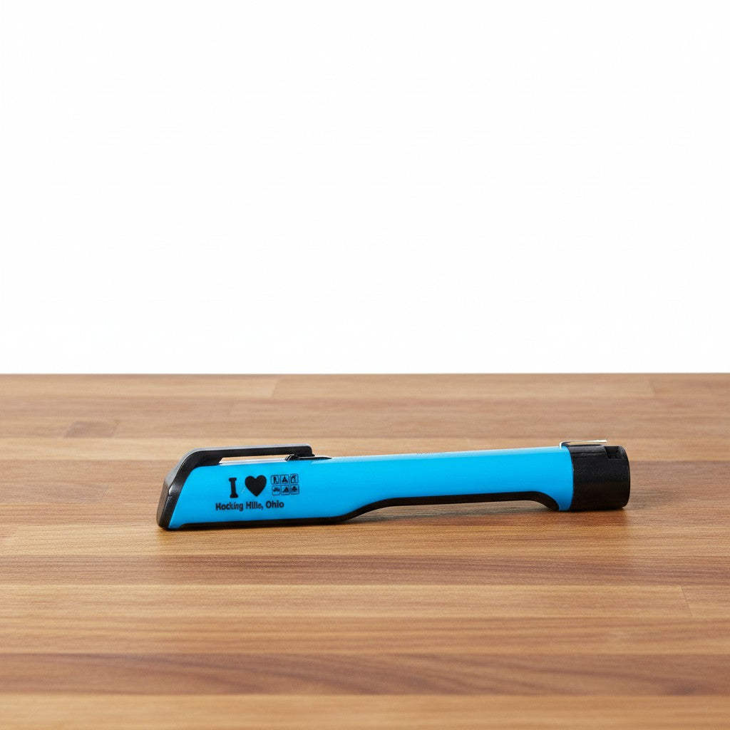 The Hocking Hills Store blue LED shirt clip trail light with black accents. Features