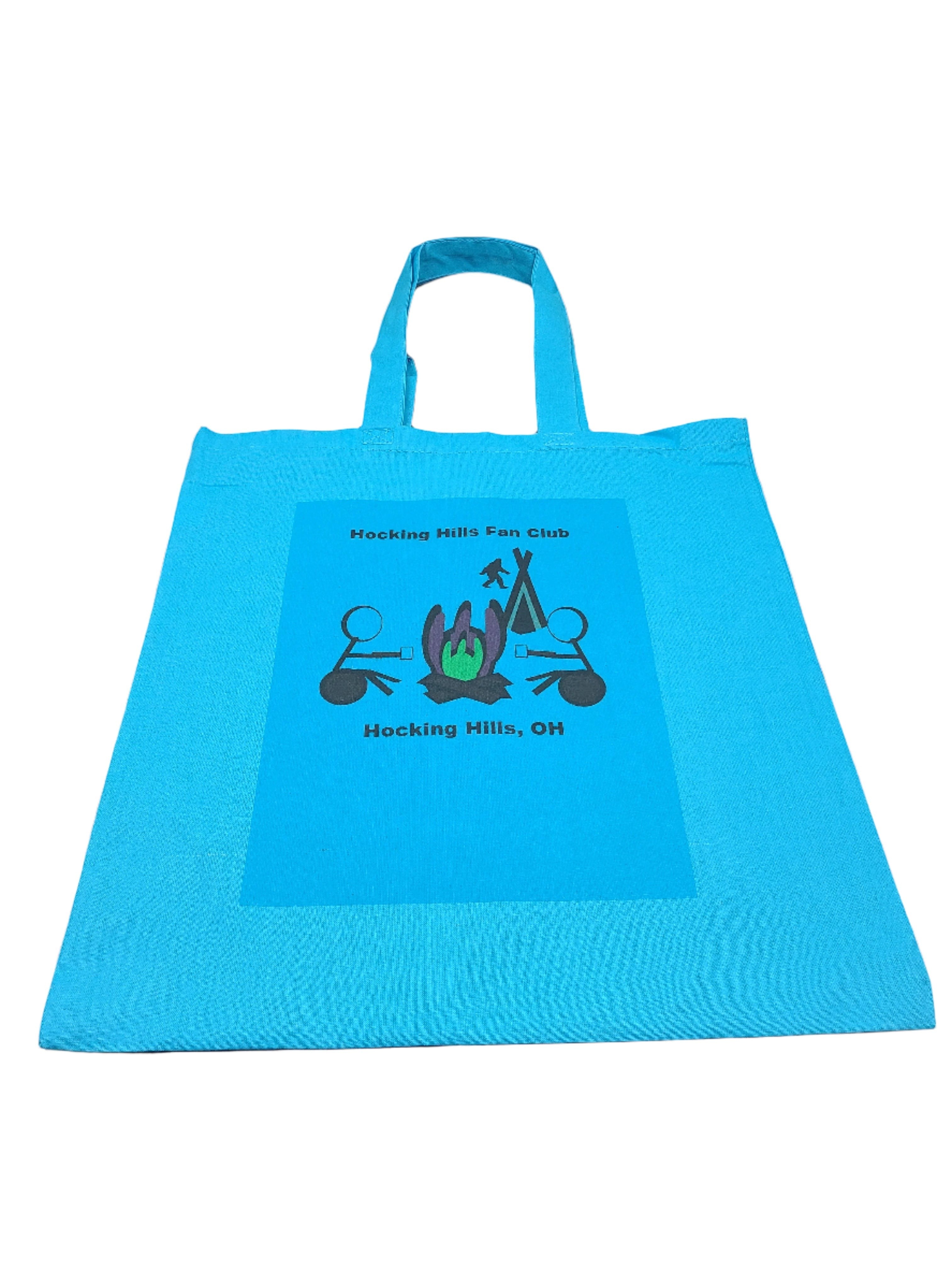 The Hocking Hills Store blue canvas tote bag with Hocking Hills Fan Club graphic and handles.