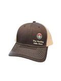 The Hocking Hills Store brown and tan trucker hat with embroidered logo, adjustable strap, and mesh back.