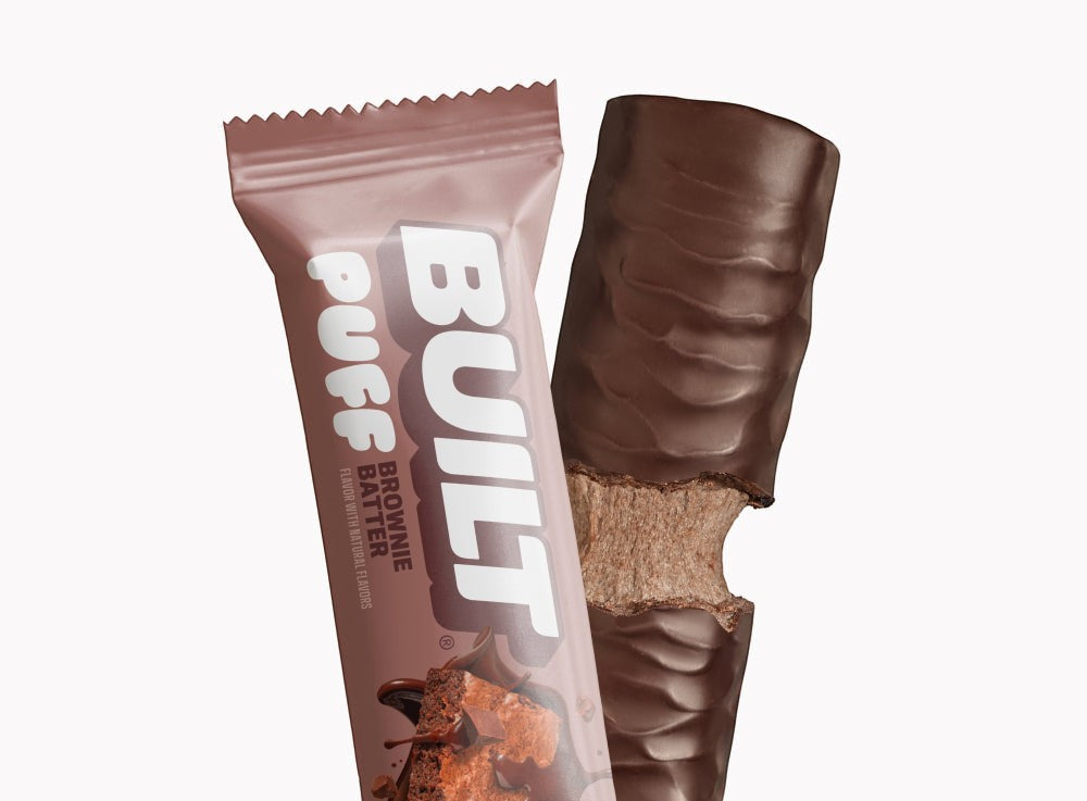 The Hocking Hills Store Brownie Batter Puff protein bar, chocolate-covered with a fluffy brownie batter center.