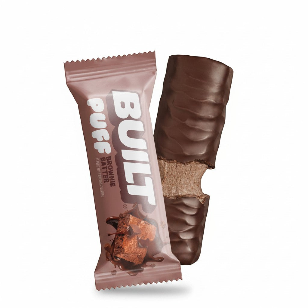 The Hocking Hills Store Brownie Batter Puff protein bar, chocolate-covered with a fluffy brownie batter center.