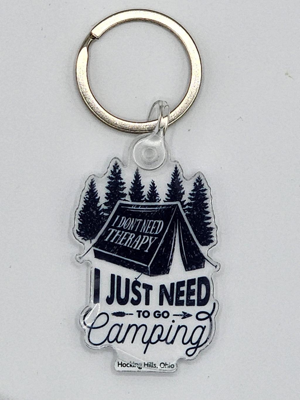 The Hocking Hills Store camping keychain features a tent, trees, and the quote "I just need to go camping."