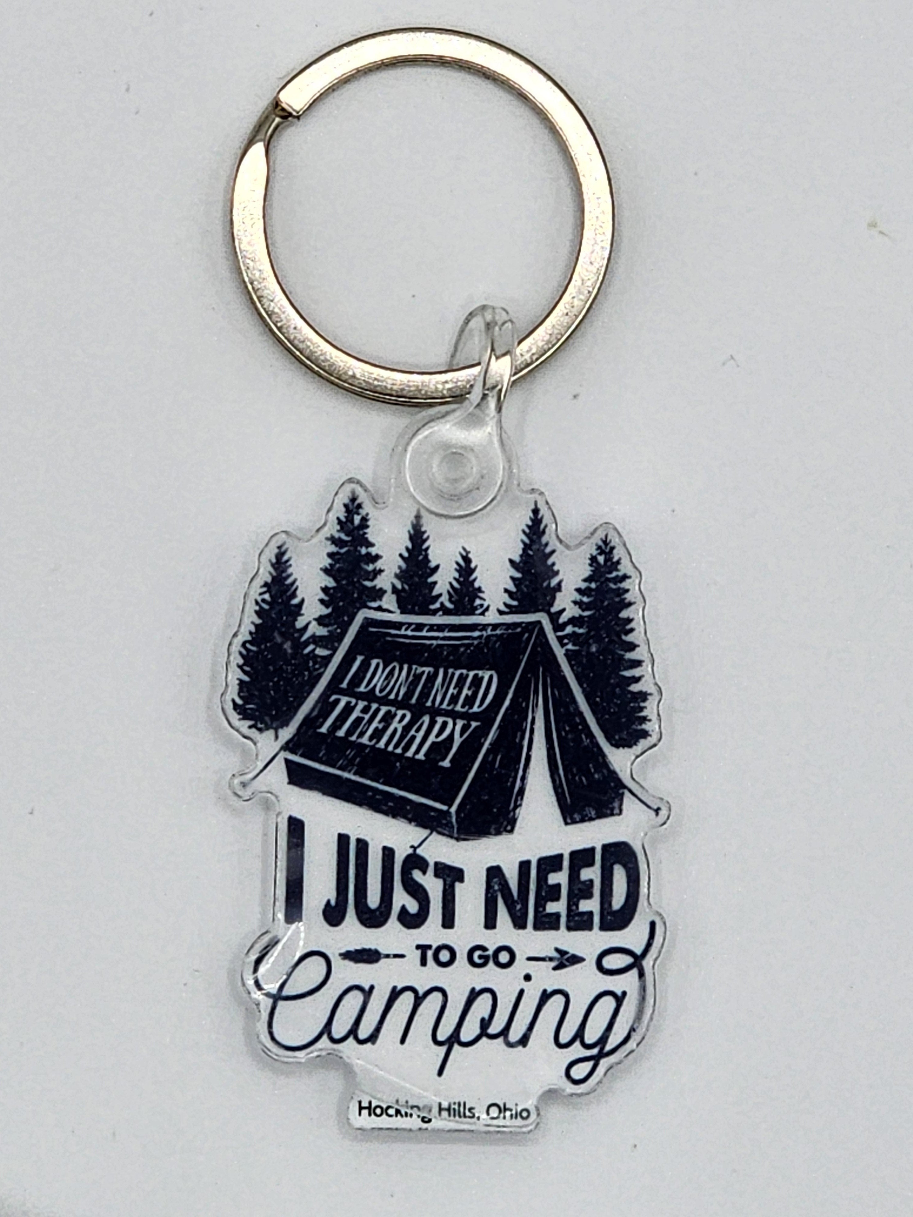 The Hocking Hills Store camping keychain features a tent, trees, and the quote "I just need to go camping."
