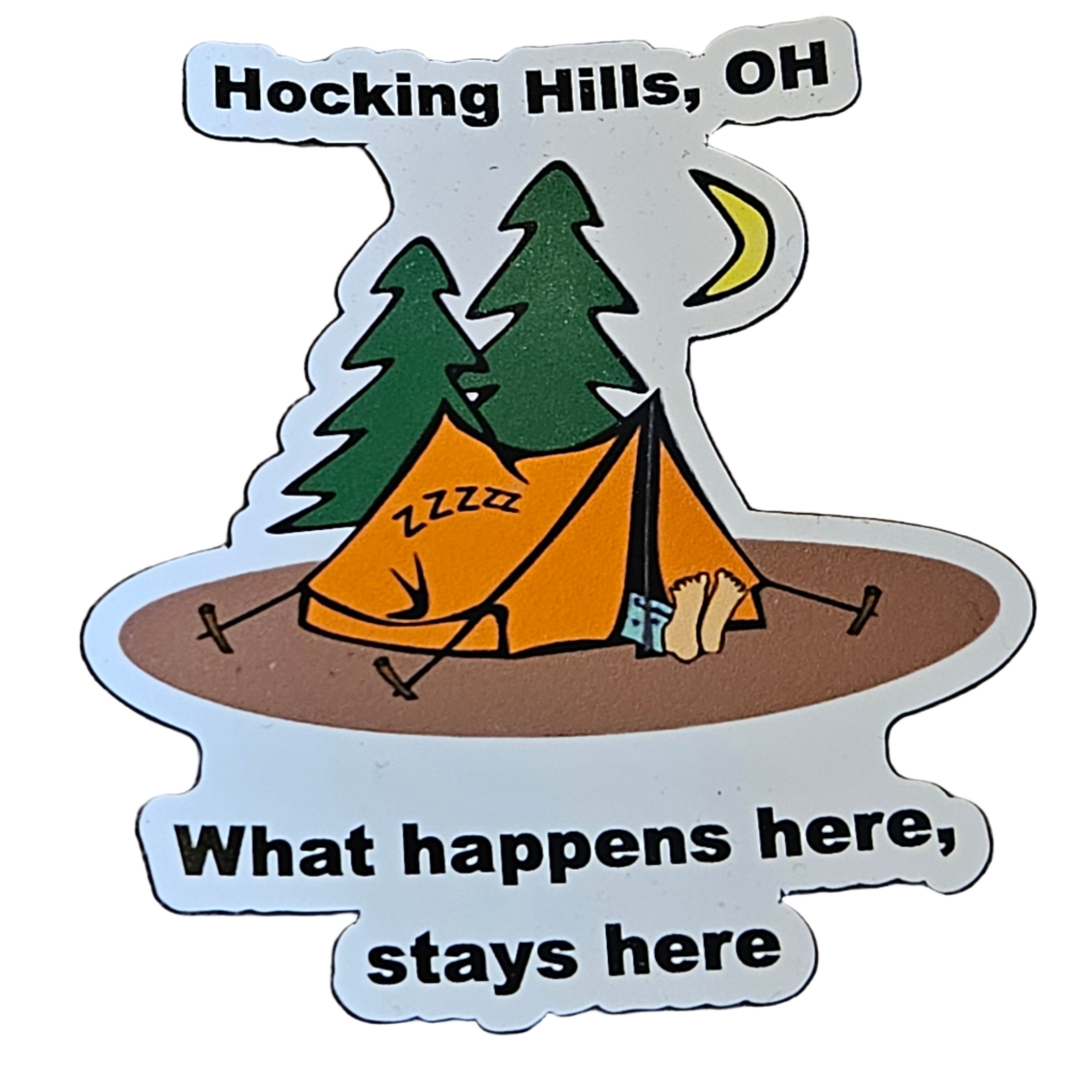 The Hocking Hills Store refrigerator magnet featuring a camping scene with an orange tent, trees, moon, and the text "What happens here, stays here."