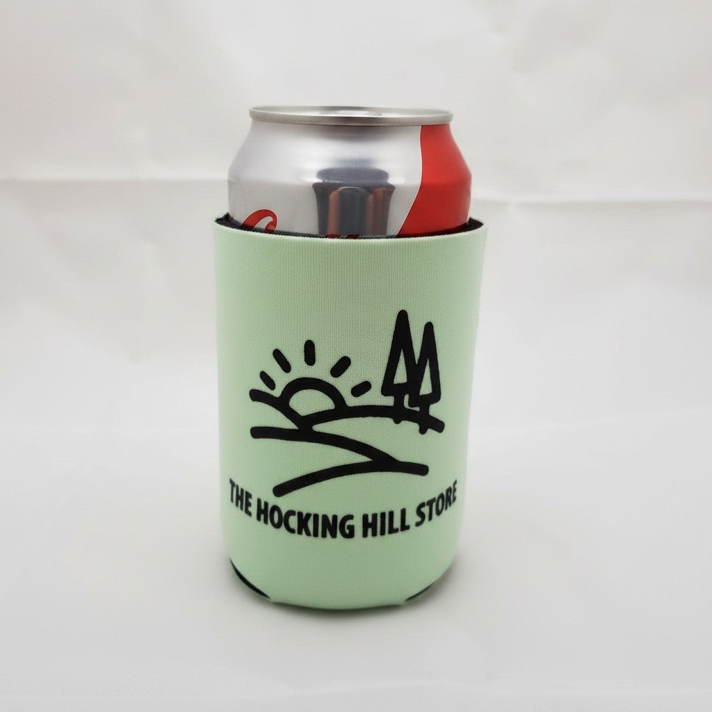 The Hocking Hills Store light green can cooler with a black graphic of hills, sun, and trees. Fits a standard can or bottle.