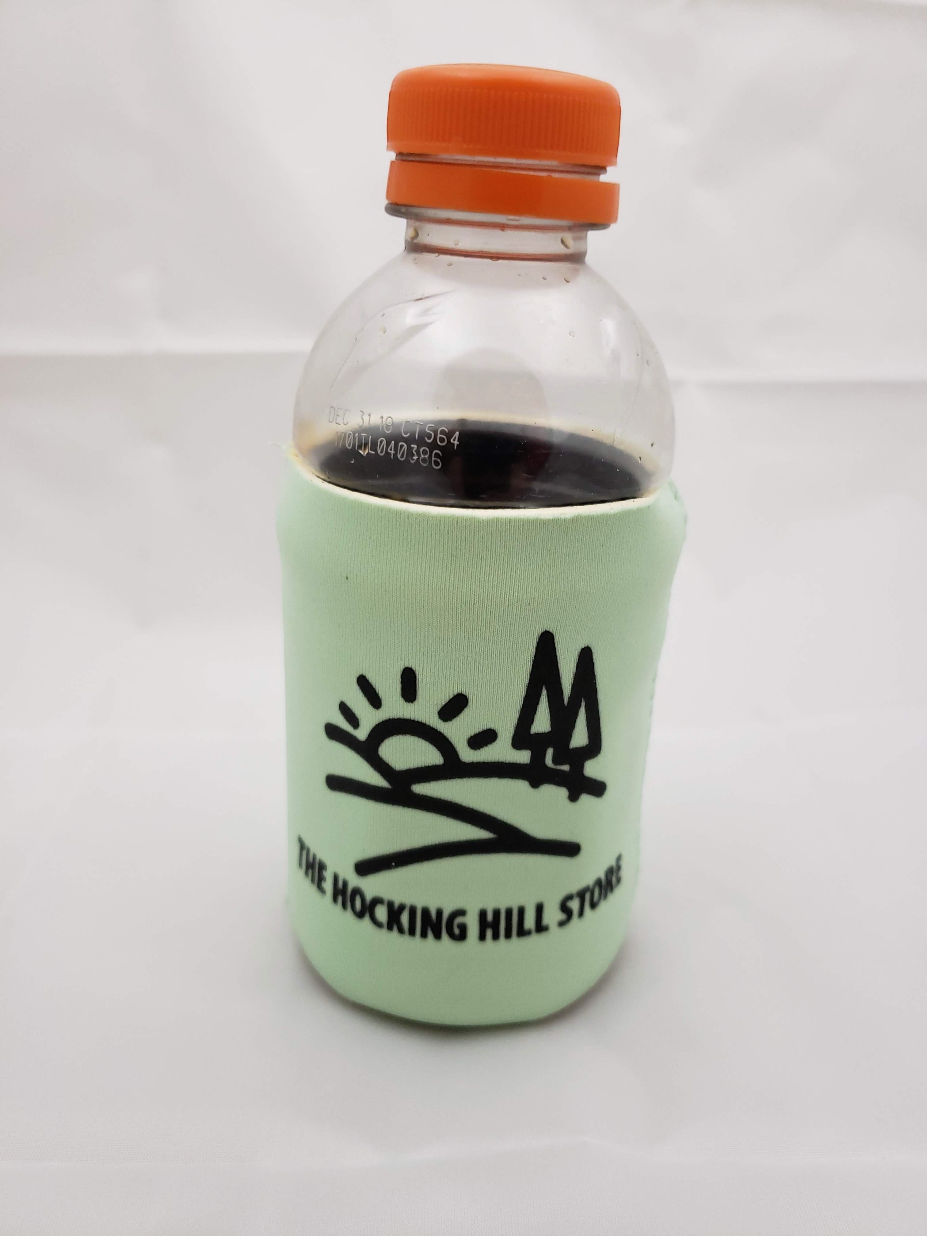 The Hocking Hills Store light green neoprene can cooler with Hocking Hills logo and orange cap bottle.