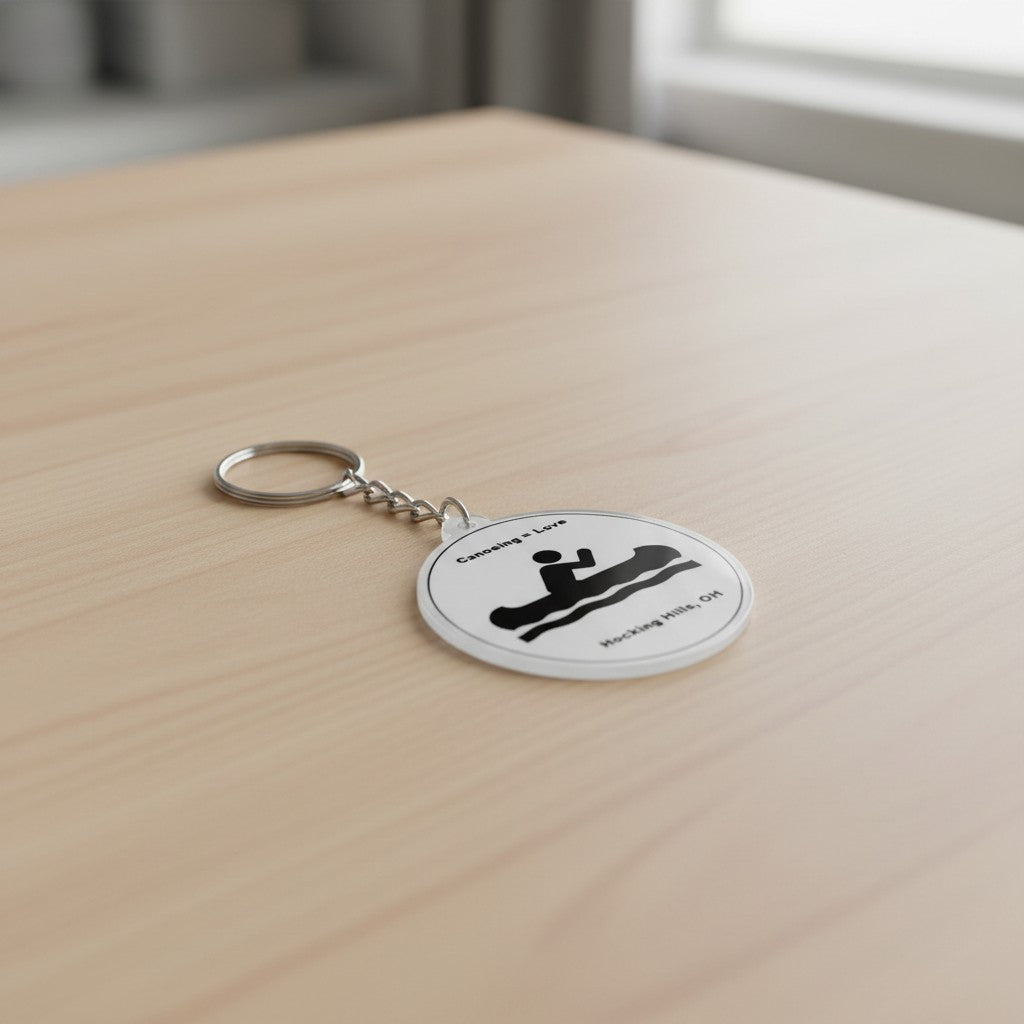 The Hocking Hills Store keychain with "Canoeing = Love" and a graphic of a person in a canoe on water. Hocking Hills, OH.