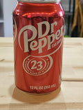 The Hocking Hills Store red Dr Pepper soda can featuring the 23 flavors logo on a wooden surface.