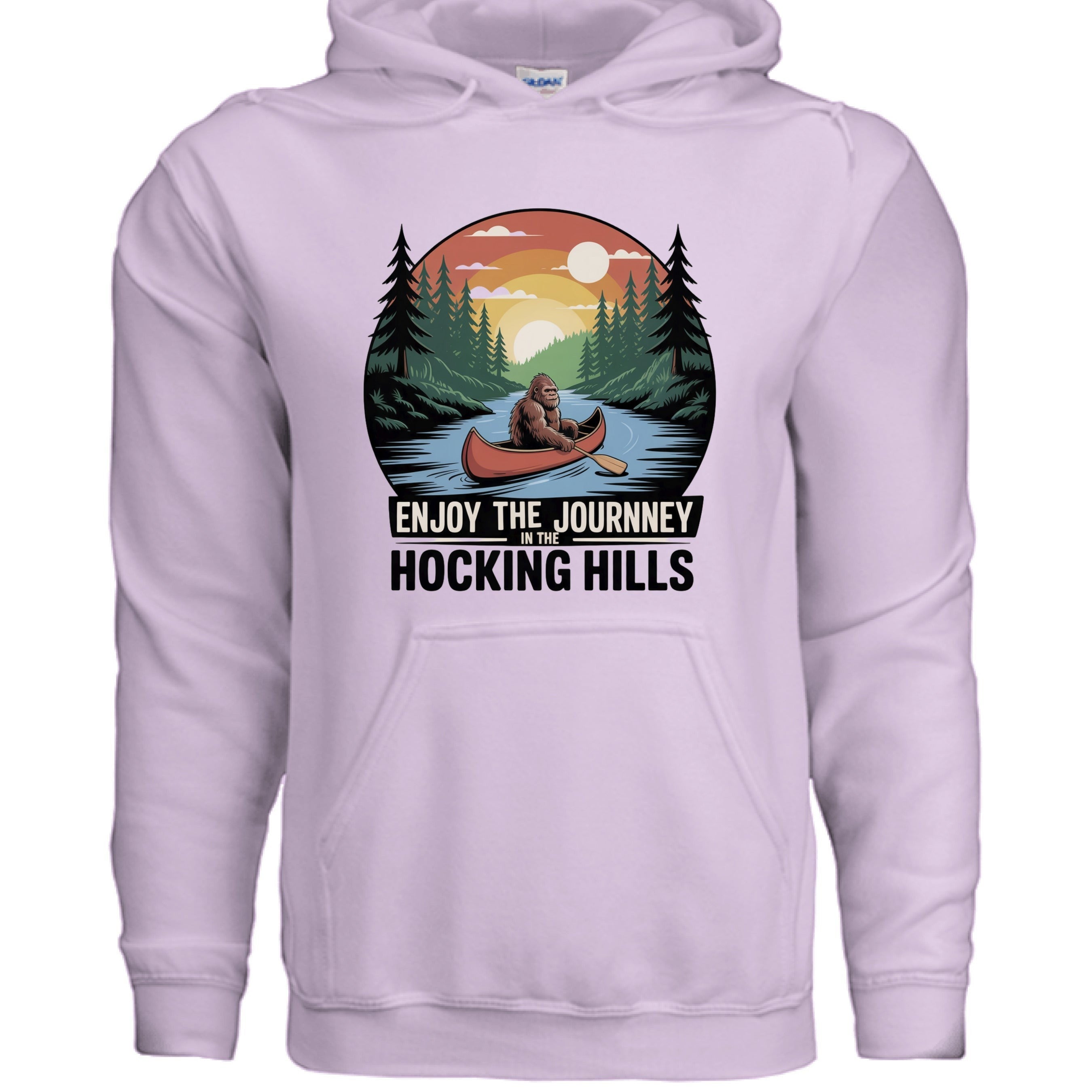 The Hocking Hills Store Enjoy The Journey hoodie in light purple, featuring a Bigfoot in a canoe graphic with trees and sunset.