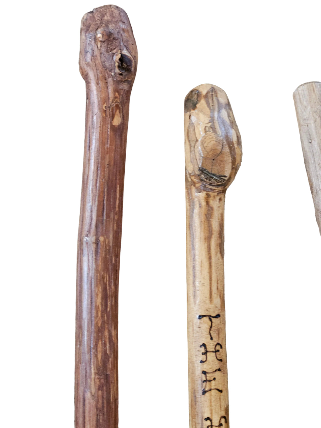 The Hocking Hills Store handmade wooden walking sticks, natural wood grain, unique carved handles, ideal for hiking and outdoor support.