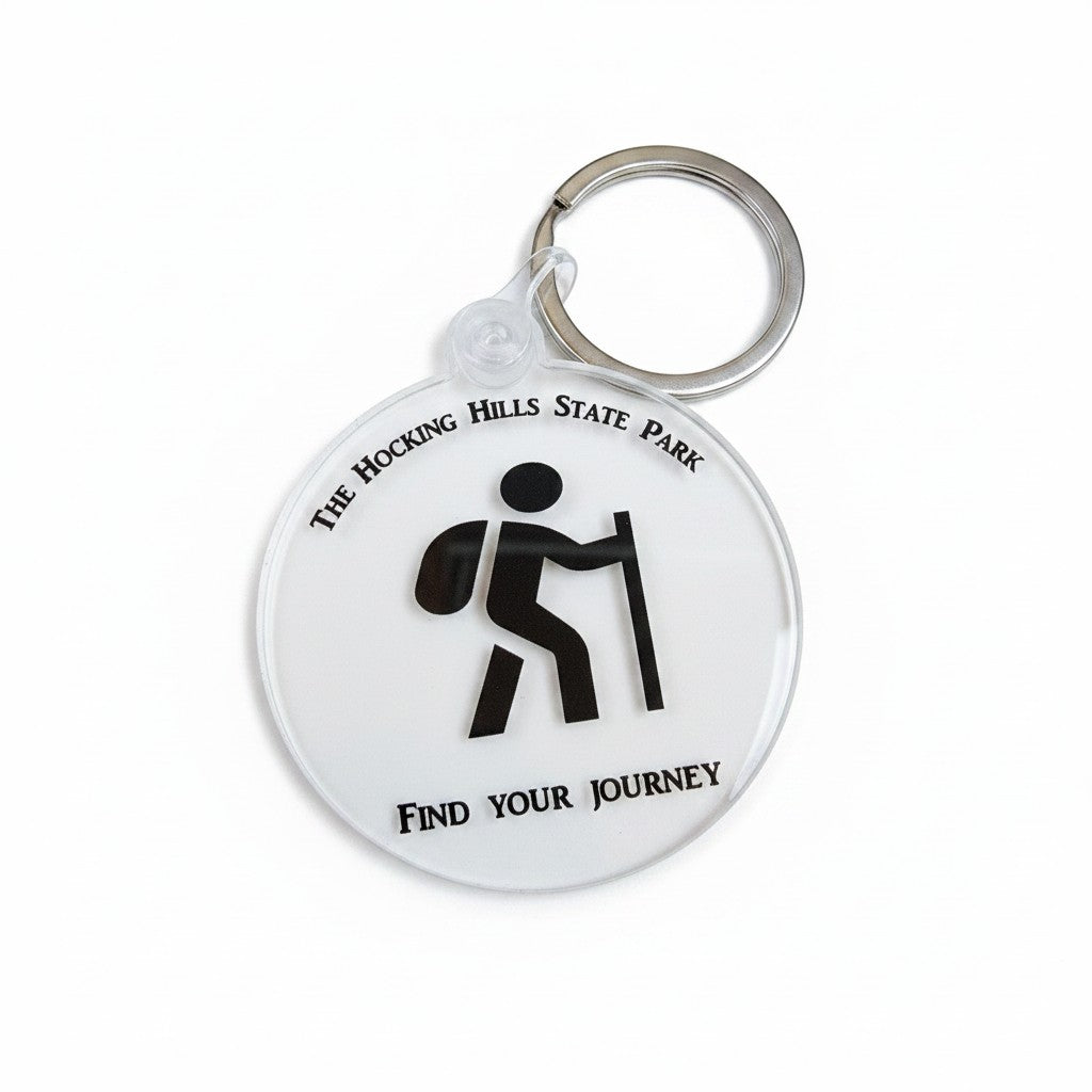 The Hocking Hills Store keychain with a hiker graphic and "Find Your Journey" text. Clear acrylic.