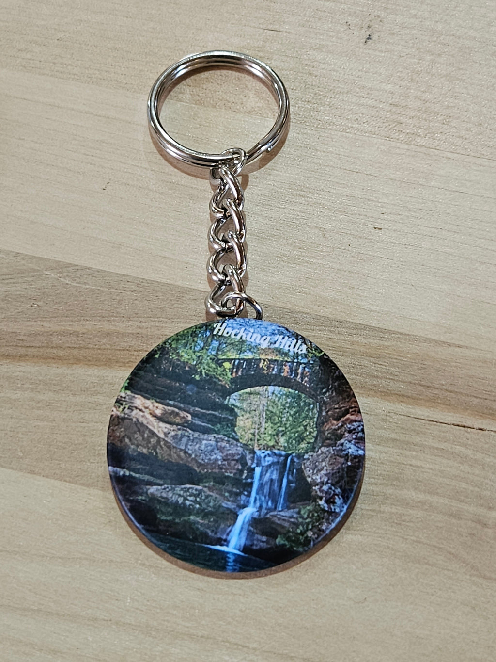 The Hocking Hills Store keychain features a scenic waterfall and stone bridge in Hocking Hills, Ohio.