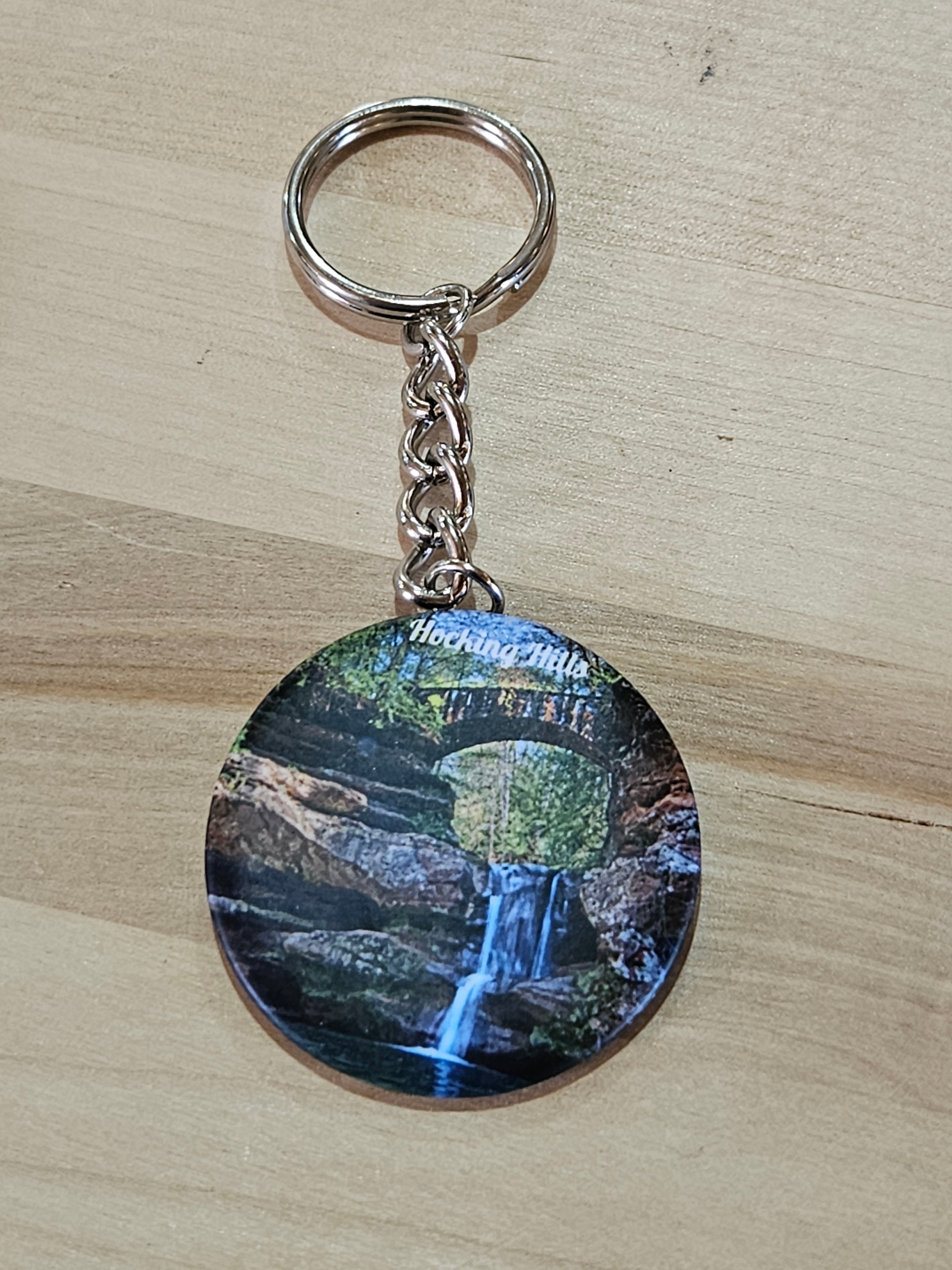 The Hocking Hills Store keychain features a scenic waterfall and stone bridge in Hocking Hills, Ohio.