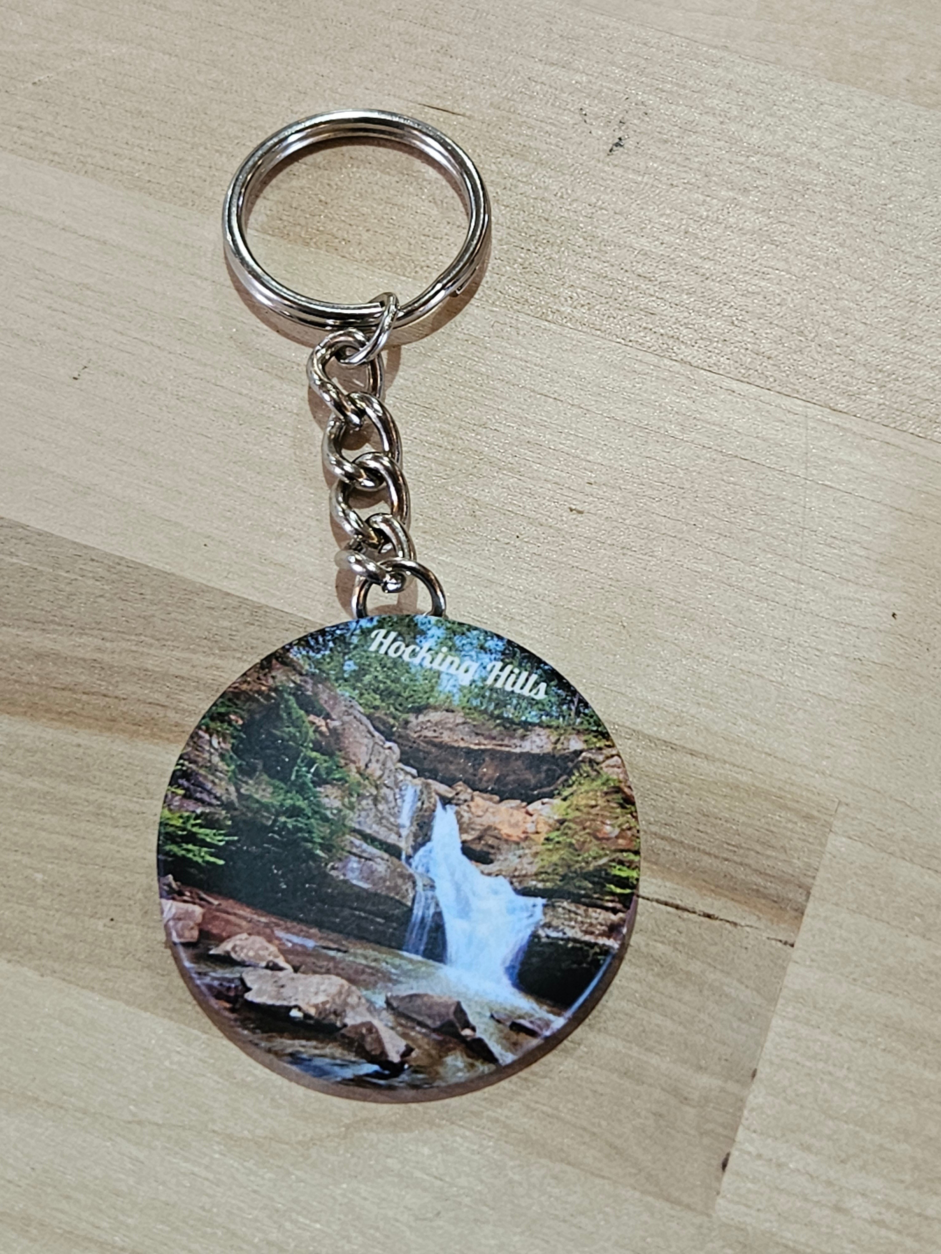 The Hocking Hills Store keychain features a scenic waterfall in Hocking Hills, Ohio, with text overlay.