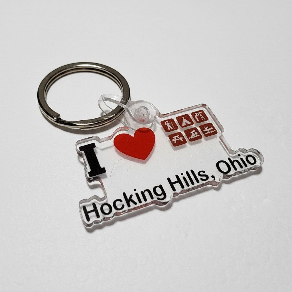 The Hocking Hills Store keychain with clear acrylic, red heart, and icons for camping, hiking, and kayaking. Text reads 'I Love Hocking Hills, Ohio'.