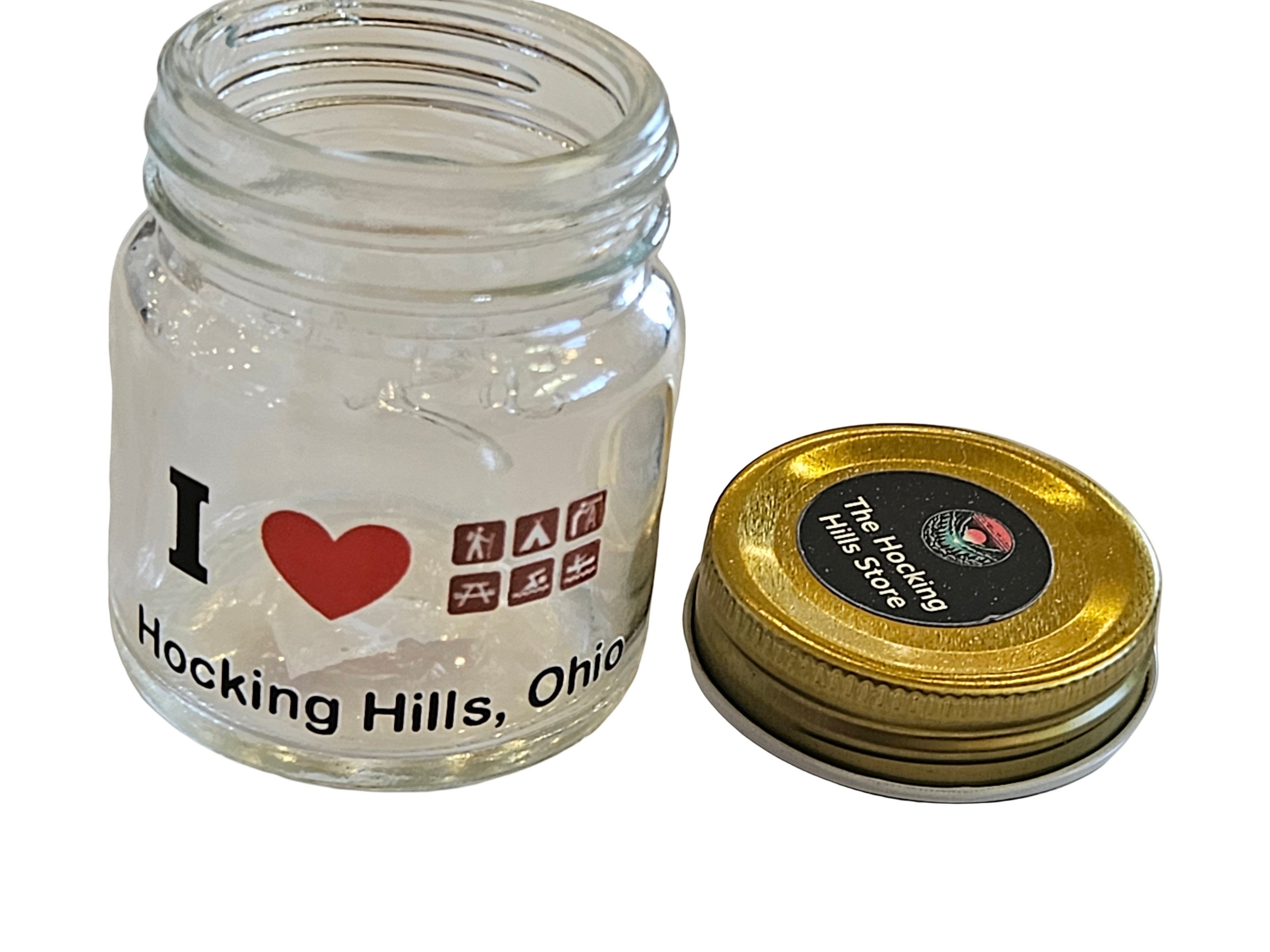 The Hocking Hills Store glass mason jar shot glass with I Love Hocking Hills, Ohio graphic and gold lid.