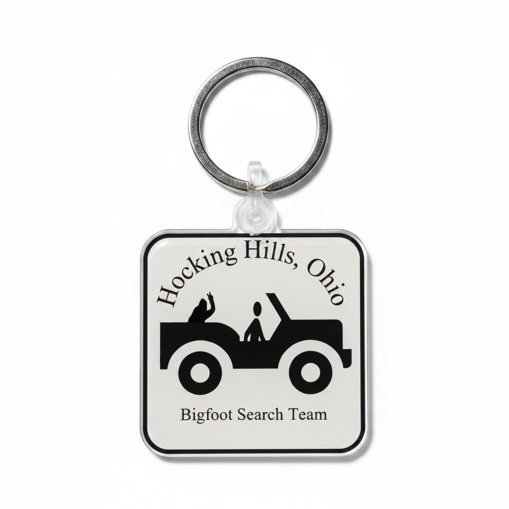The Hocking Hills Store Bigfoot Search Team keychain features a Jeep graphic and text. Silver keyring attached.
