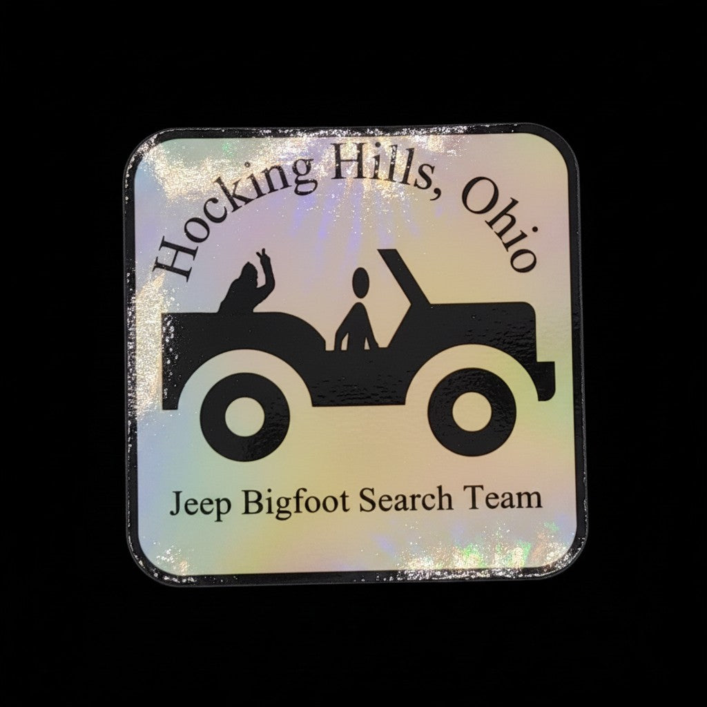 The Hocking Hills Store holographic bumper sticker featuring a Jeep silhouette with two figures and "Jeep Bigfoot Search Team" text.