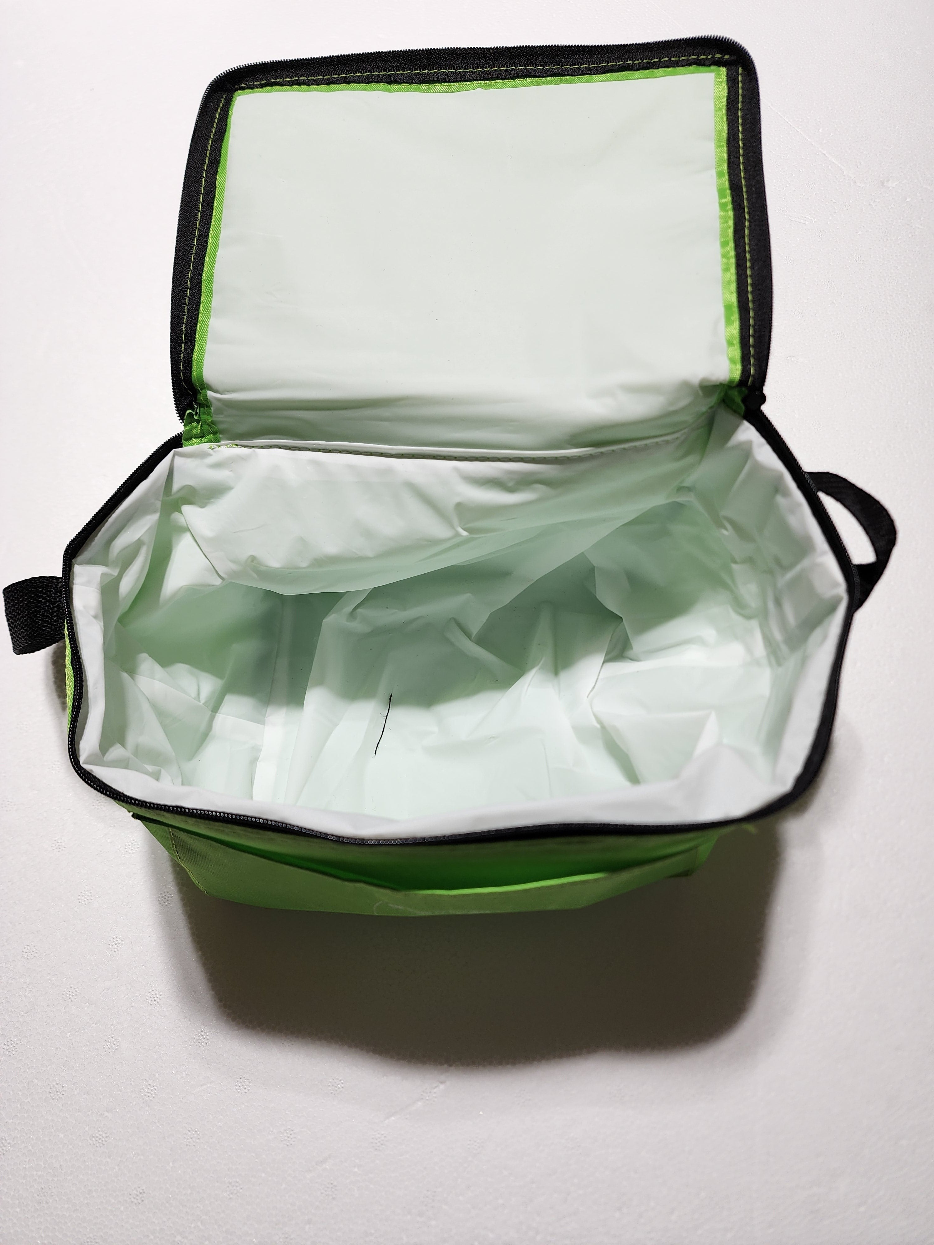 The Hocking Hills Store 6 pack soft cooler in lime green with black trim, open to show insulated interior.