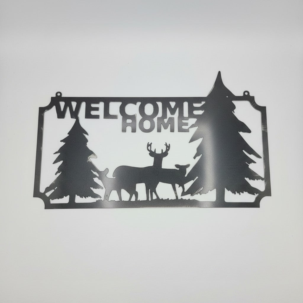 The Hocking Hills Store metal art sign with "WELCOME HOME" text, featuring pine trees and deer silhouettes. Black metal.