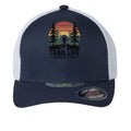The Hocking Hills Store navy blue trucker hat with white mesh back, featuring a "Trail Life" graphic with a hiker and sunset.