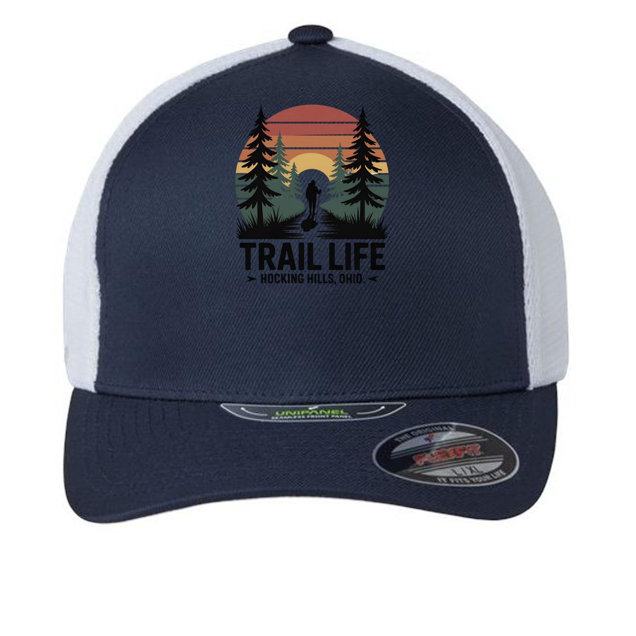 The Hocking Hills Store navy blue trucker hat with white mesh back, featuring a "Trail Life" graphic with a hiker and sunset.
