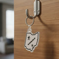 The Hocking Hills Store Ohio keychain featuring a hiker icon and tree graphic. Clear acrylic.