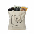 The Hocking Hills Store natural canvas tote bag with a black outline of Ohio, a hiker graphic, and text that reads "Find your journey in the Hocking Hills, OH".