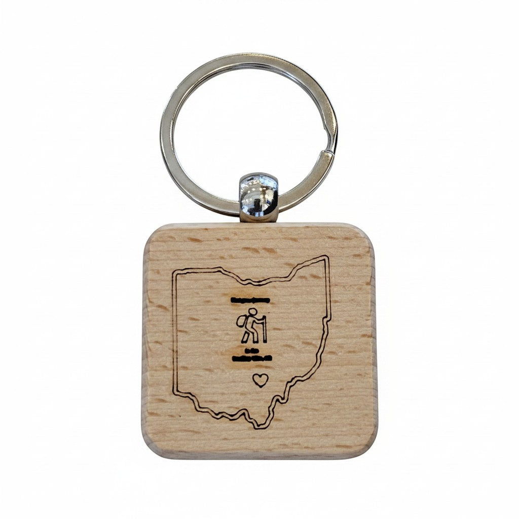 The Hocking Hills Store wooden keychain featuring a laser-engraved outline of Ohio with a hiker icon and heart.