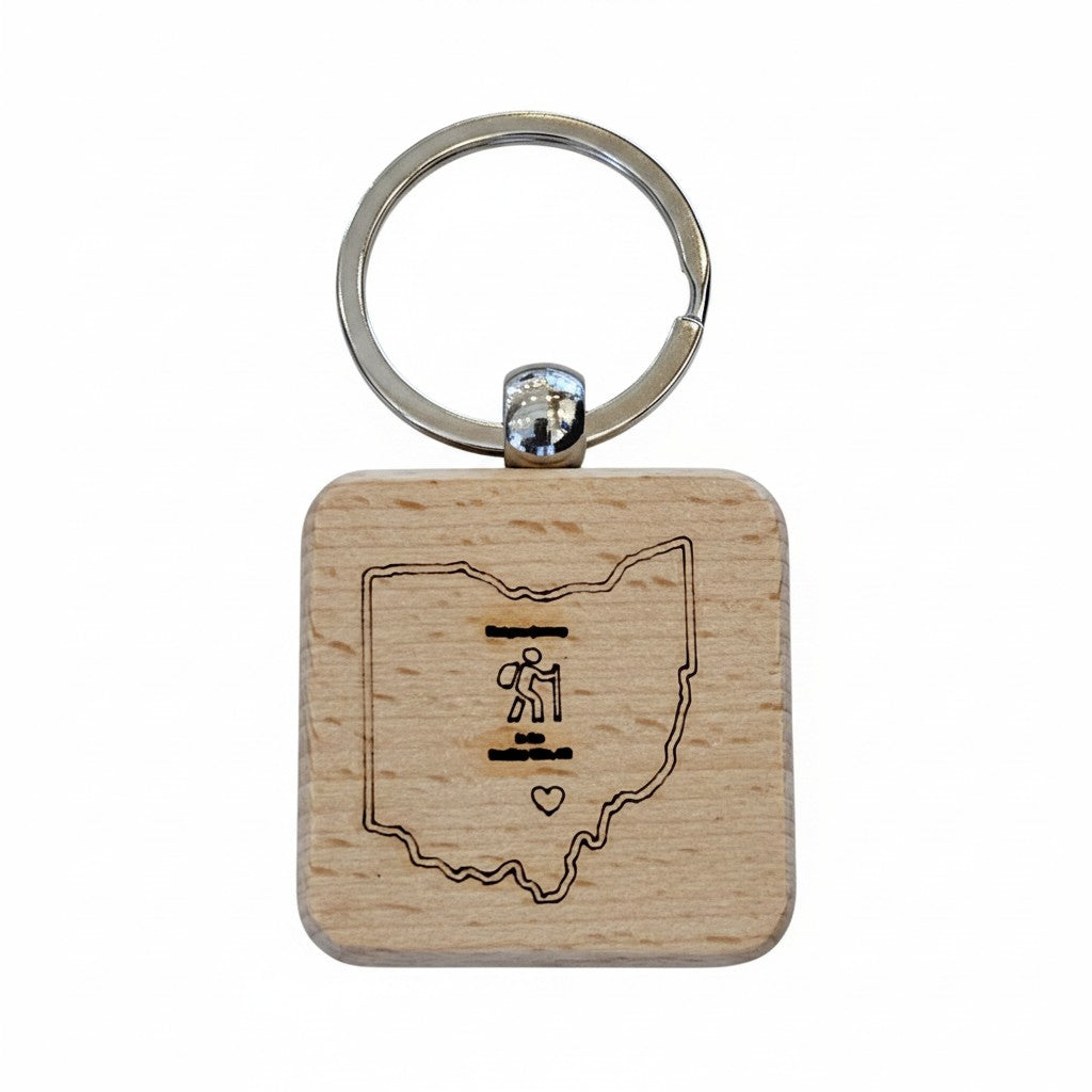 The Hocking Hills Store Ohio wood keychain with laser engraved outline of Ohio, a hiker icon, and a heart.
