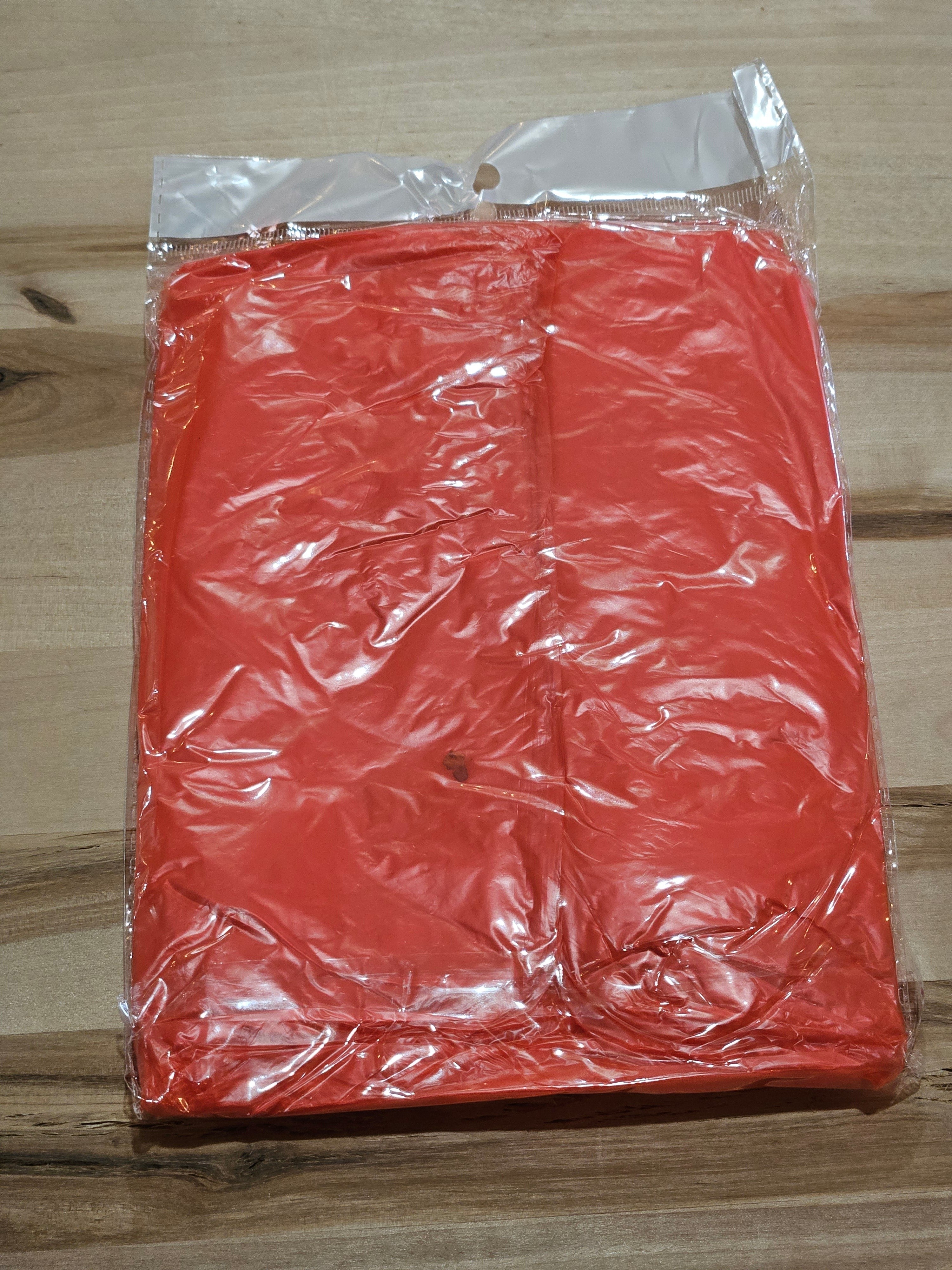 The Hocking Hills Store disposable emergency rain poncho in bright orange, folded in clear plastic packaging.