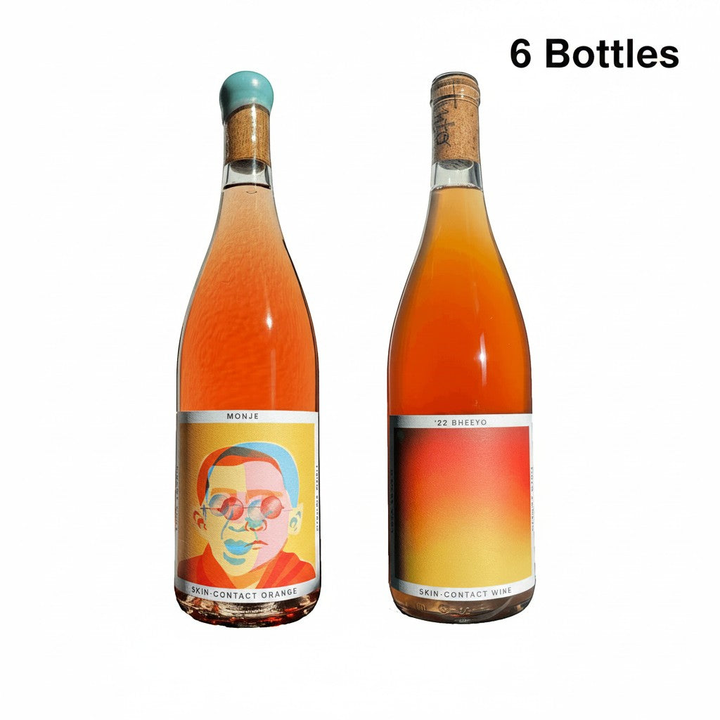 The Hocking Hills Store Orange Wine Sampler featuring two bottles: Monje Skin-Contact Orange Wine and '22 Bheeyo Skin-Contact Wine.