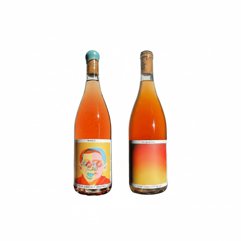 The Hocking Hills Store Orange Wine Sampler featuring two bottles: Monje Skin-Contact Orange Wine and '22 Bheeyo Skin-Contact Wine.