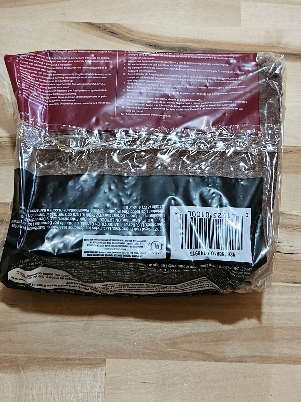 The Hocking Hills Store Pine Mountain Starter Log in plastic packaging with printed instructions and barcode