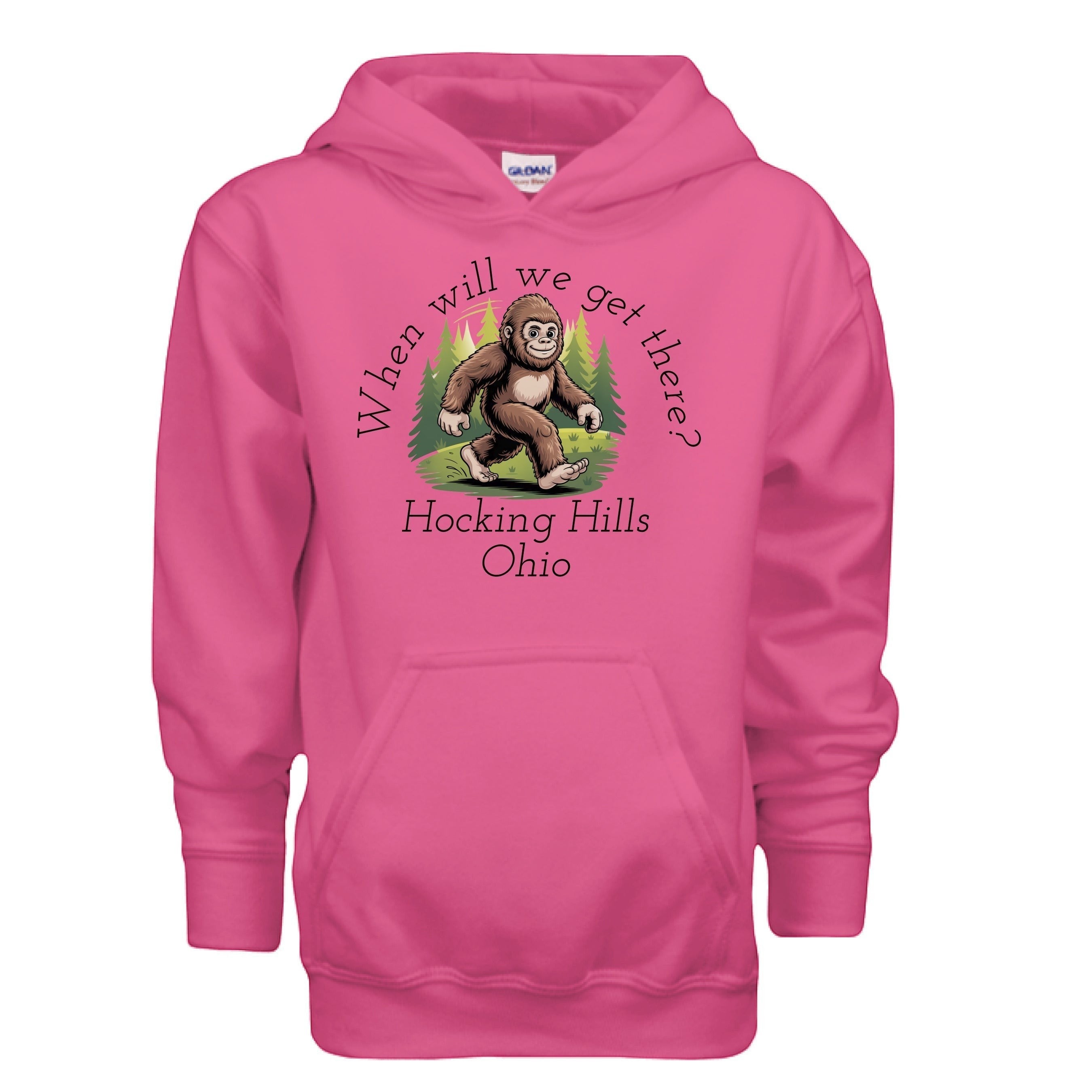 The Hocking Hills Store pink youth hoodie with a Bigfoot graphic and "When Will We Get There?" text.