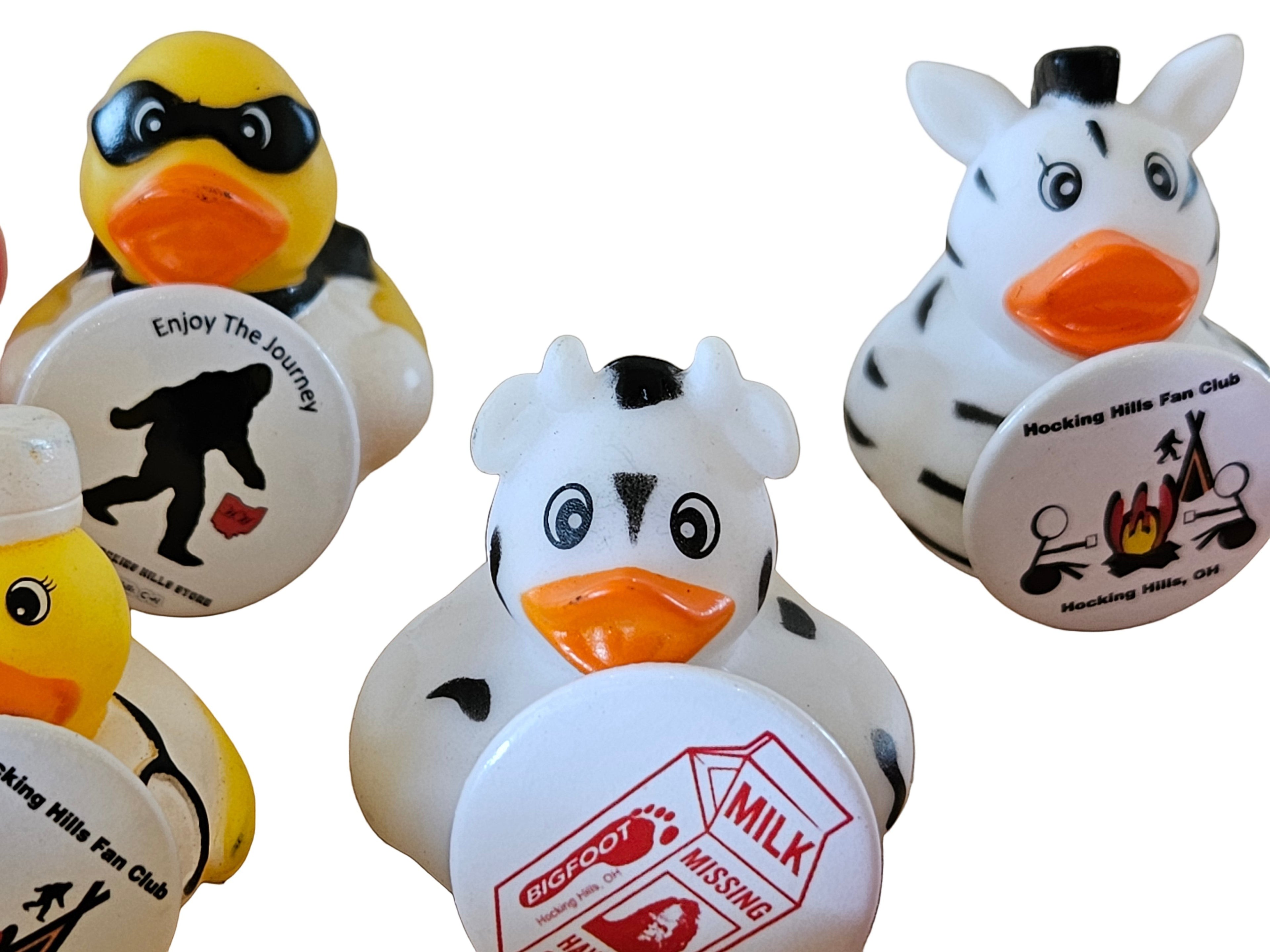 The Hocking Hills Store Pinned Jeep Ducks collection features a Bigfoot duck, a cow duck, and a zebra duck, each with unique pins.
