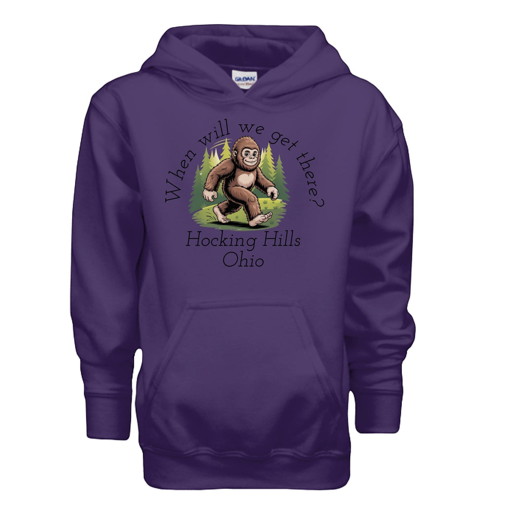 The Hocking Hills Store purple youth hoodie with a Bigfoot graphic and "When Will We Get There? Hocking Hills Ohio" text.