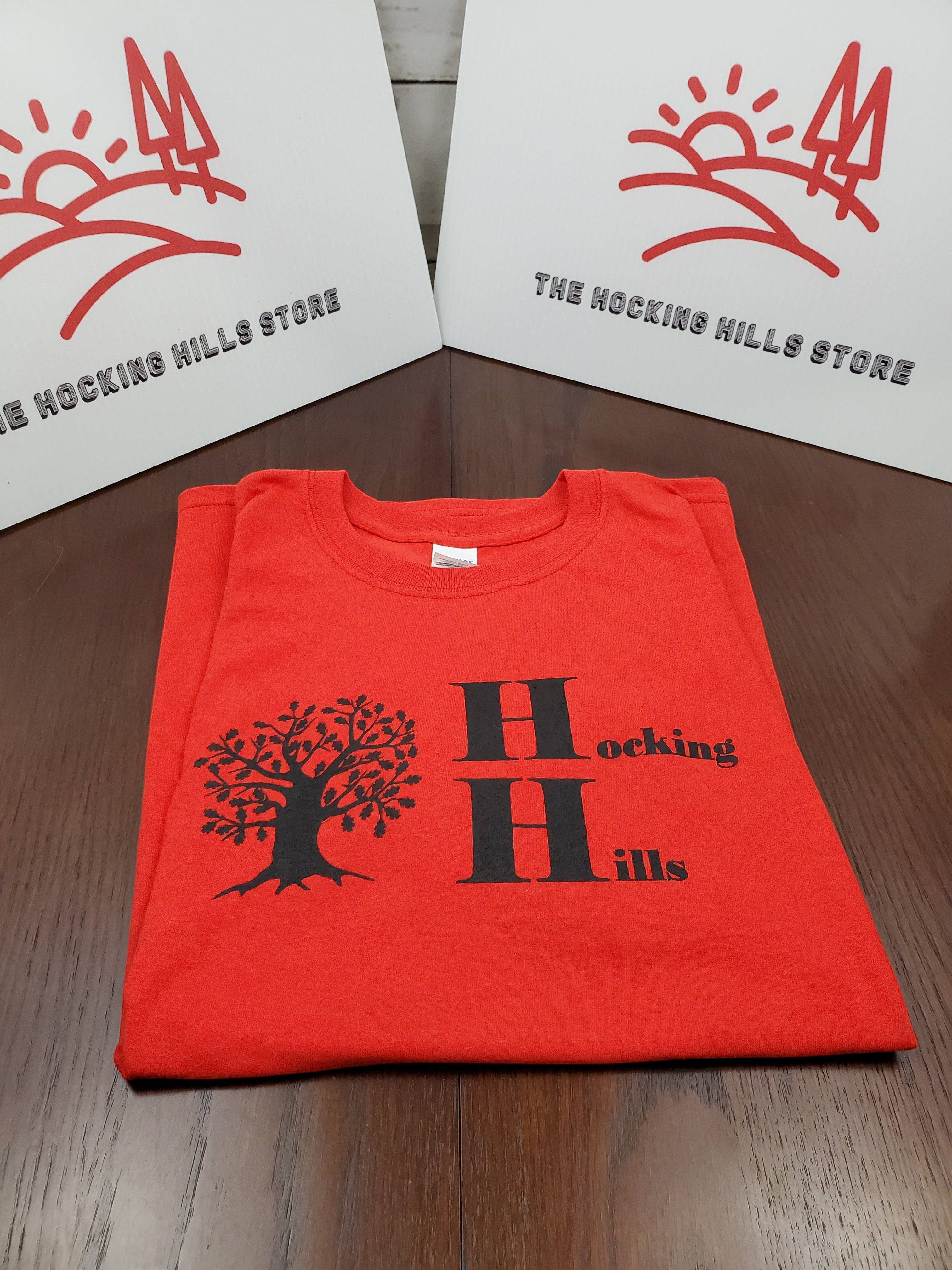 The Hocking Hills Store red cotton t-shirt with black Hocking Hills logo and oak tree graphic.