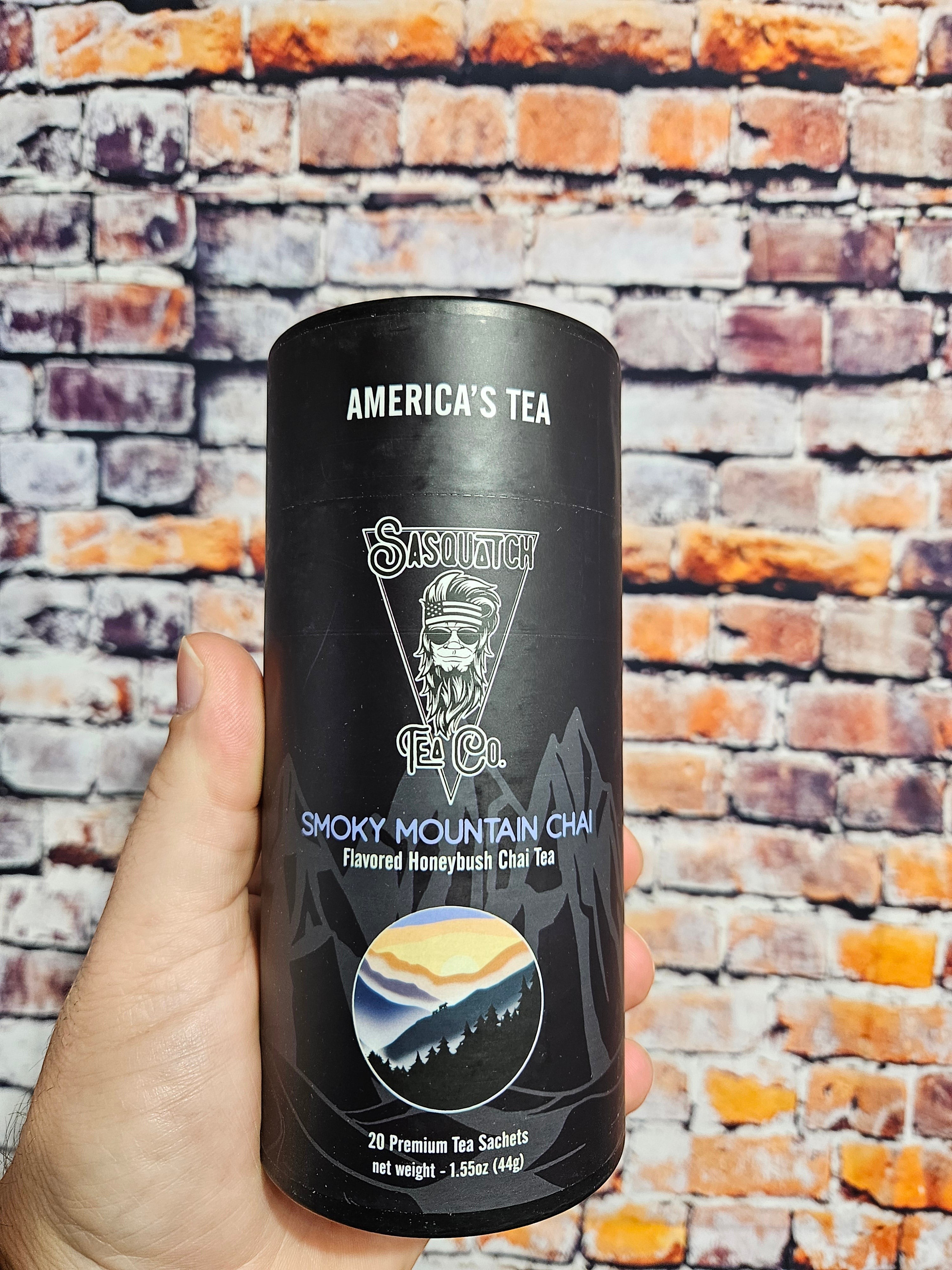 The Hocking Hills Store's Sasquatch Tea Co. Smoky Mountain Chai flavored honeybush tea in a black cylinder with mountain imagery.